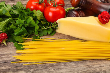 Raw Italian spaghetti heap with cheese