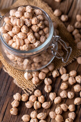 Dried raw chickpea on the wooden background
