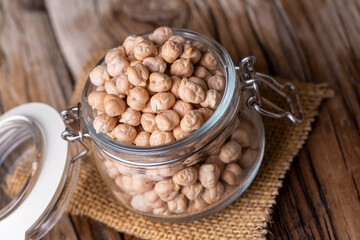 Dried raw chickpea on the wooden background