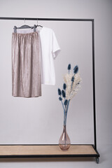 Basic women's clothes. Woman minimalist wardrobe in white and beige. Spring fashion trending concept