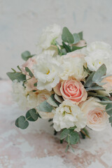Wedding flowers, bridal bouquet close-up. Decoration of roses, peonies and ornamental plants, close-up, selective focus.