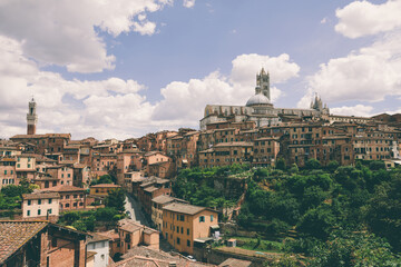 Fototapeta na wymiar Panoramic view of Siena city with historic buildings and street