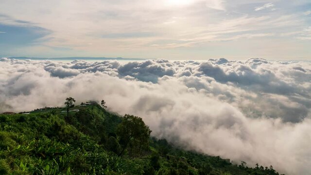 4K Time lapse clouds as the sky sunrise fog form misty nature ridge mountains Time passes slowly, fog and clouds are beautiful.
