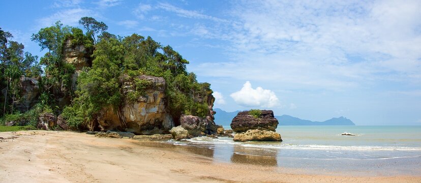 Sandy beach (Telok Paku) with rocks in Bako National Park, Borneo, Sarawak, Malaysia