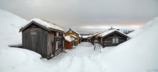 Snow covered street and buildings in Roros Norway