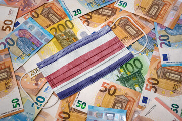 Medical mask with the flag of Costa Rica on a variety of european banknotes.(series)