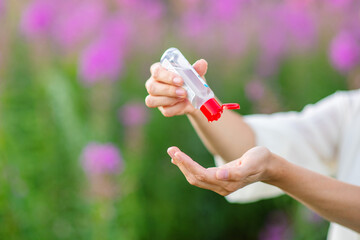 Hands are treated with a sanitizer with alcohol. Rules of conduct during quarantine concept