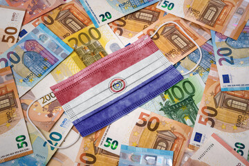 Medical mask with the flag of Paraguay on a variety of european banknotes.(series)