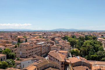 Fototapeta premium Panoramic view of Pisa city with historic buildings and far away mountains