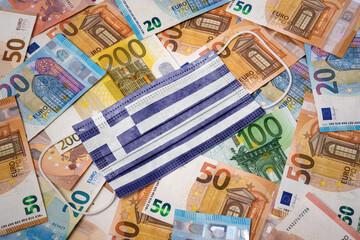 Medical mask with the flag of Greece on a variety of european banknotes.(series)