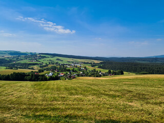 Fototapeta na wymiar Landscape with fields and a blue sky
