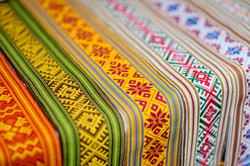Details of a traditional Lithuanian weave. Woven belts as a part of national Lithuanian costume sold on traditional Easter fair in Vilnius, Lithuania - obrazy, fototapety, plakaty