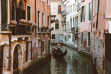 Panoramic view of Venice canal with historical buildings and gondolas