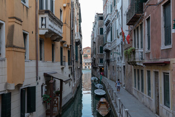 Naklejka na ściany i meble Panoramic view of Venice canal with historical buildings and gondolas