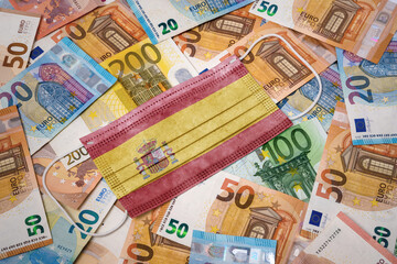 Medical mask with the flag of Spain on a variety of european banknotes.(series)