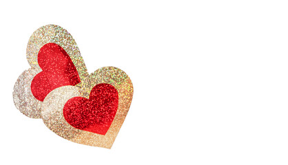 Two red-gold shiny hearts on a white background. Valentine's Day concept.