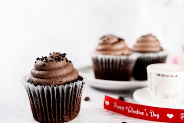 Chocolate cupcake served in on a  plate, selective focus
