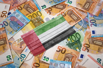 Medical mask with the flag of United Arab Emirates on a variety of european banknotes.(series)