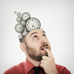 Clocks fly out of the man's head. Time management and deadlines concept.