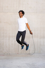 Afro athletic man doing exercise outdoors.