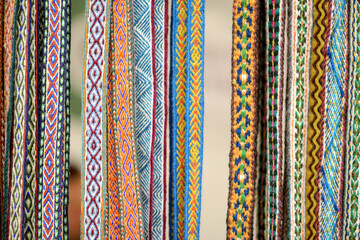 Details of a traditional Lithuanian weave. Woven belts as a part of national Lithuanian costume sold on traditional Easter fair in Vilnius, Lithuania