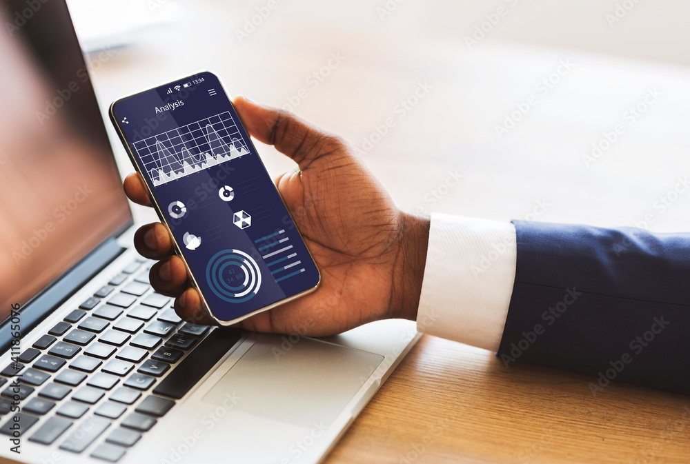 Poster unrecognizable businessman checking financial analysis on smartphone, using modern application on wo