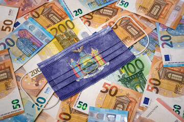 Medical mask with the flag of New York on a variety of european banknotes.(series)