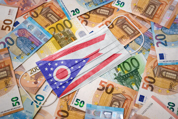 Medical mask with the flag of Ohio on a variety of european banknotes.(series)