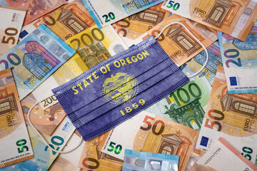Medical mask with the flag of Oregon on a variety of european banknotes.(series)