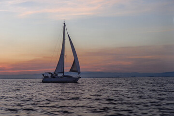 Plakat sailboat at sunset