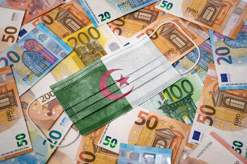 Obraz na płótnie Canvas Medical mask with the flag of Algeria on a variety of european banknotes.(series)