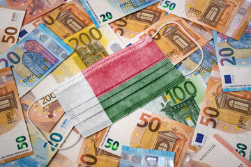 Medical mask with the flag of Madagascar on a variety of european banknotes.(series)