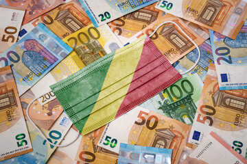 Medical mask with the flag of Republic of the Congo on a variety of european banknotes.(series)