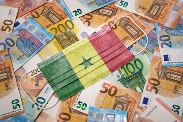 Medical mask with the flag of Senegal on a variety of european banknotes.(series)