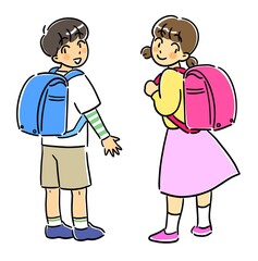 ランドセルを背負って振り向く男の子と女の子