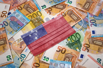 Medical mask with the flag of Samoa on a variety of european banknotes.(series)