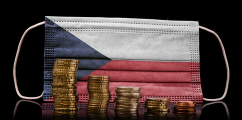 Medical mask with the flag of Czech Republic behind some shrinking stacks of various coins.(series)