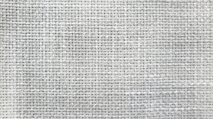 Fototapeta na wymiar light gray linen texture, burlap fabric as background. close up grey weaving or mesh fabric texture background. 