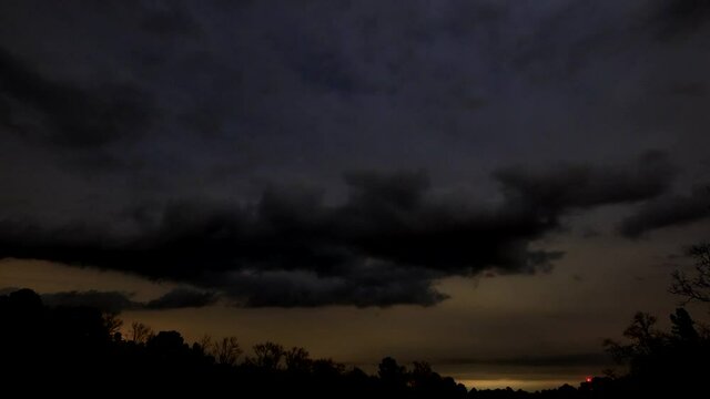 Passing clouds as stars rise and sometimes show through, time lapse