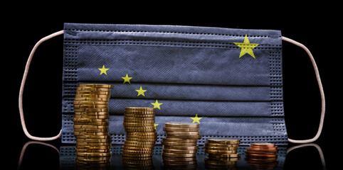 Medical mask with the flag of Alaska behind some shrinking stacks of various coins.(series)