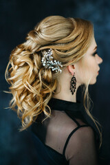 Blonde girl with blue eyes in a black dress © omelnickiy