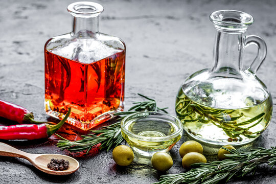 natural oils concept with fresh olives and chili paper on table background