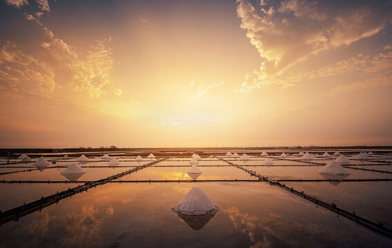Salt piles in a salt flat at sunrise, Tainan, Taiwan