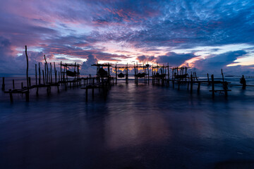 Morning view before sunrise Fishing boat's harbor service at Bang Hoi Beach, Songlkhla, Thailand.
