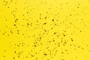 Golden foil sparkles on pink background. Festive backdrop