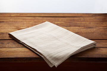 Empty canvas napkin on wooden desk front view, perspective