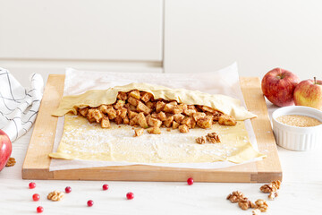 making strudel - dough, apples, cinnamon, nuts, brown sugar. process and ingredients