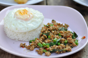 stir fried pork with holy basil and cow pea, fried egg and rice