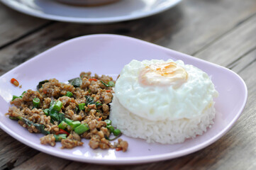 stir fried pork with holy basil and cow pea, fried egg and rice