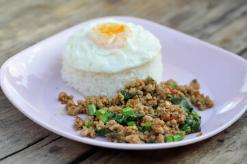 stir fried pork with holy basil and cow pea, fried egg and rice